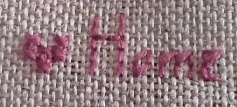 Broderie / Un petit coussin de porte en vue ?