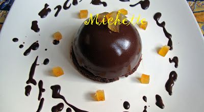 Crémeux au chocolat, coeur à l'orange, dacquoise au cacao, glaçage brillant cacaoté