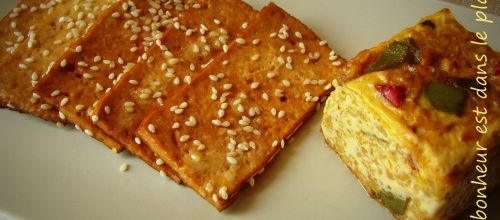 Carpaccio de Tofu mariné au thé fumé et petit flan de boulgour aux deux poivrons.