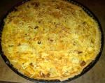 Quiche  fondue d'oignons, lardons et pommes de terre et sa pâte  express Tupperware